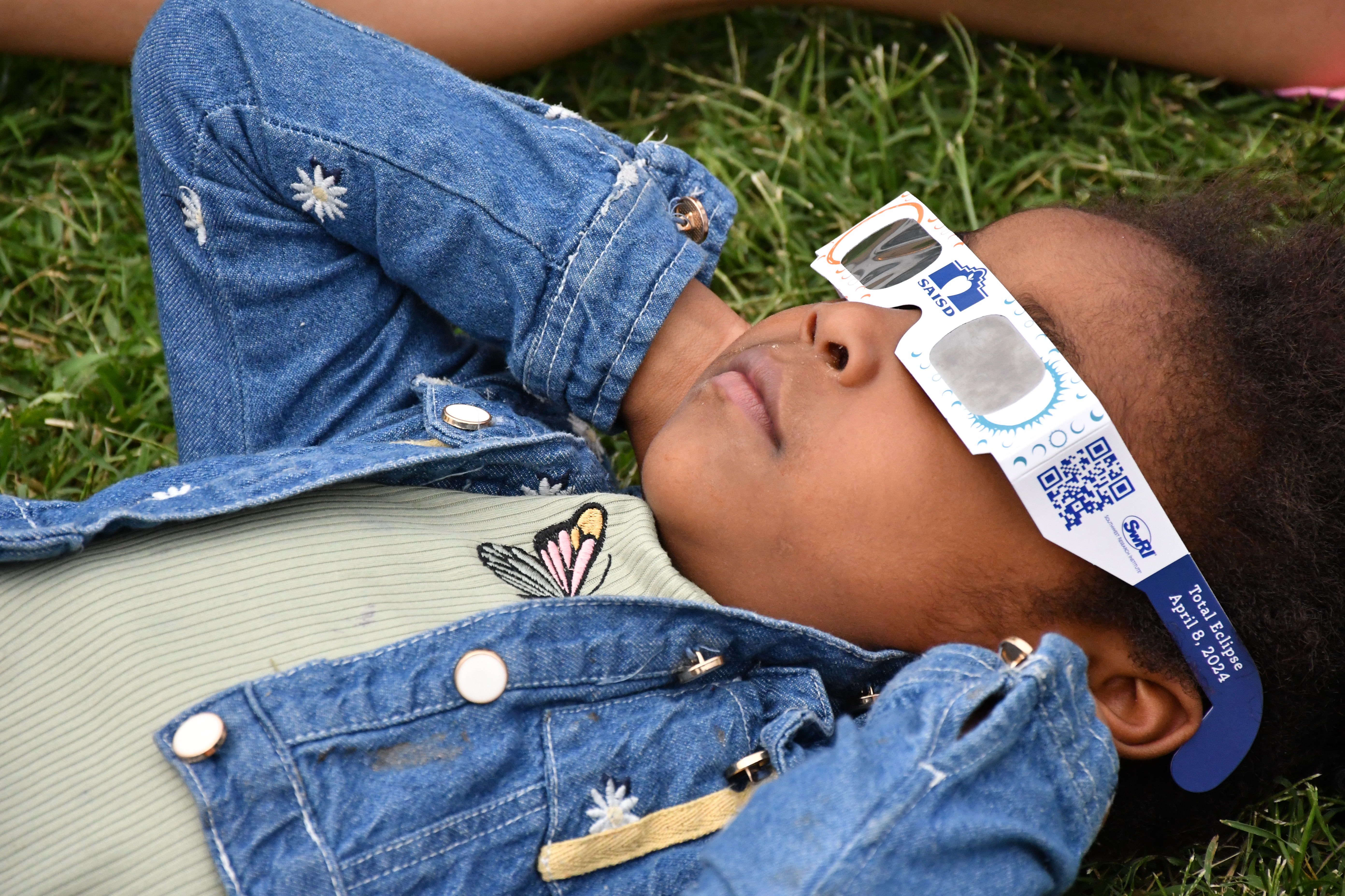 Student with solar eclipse glasses 