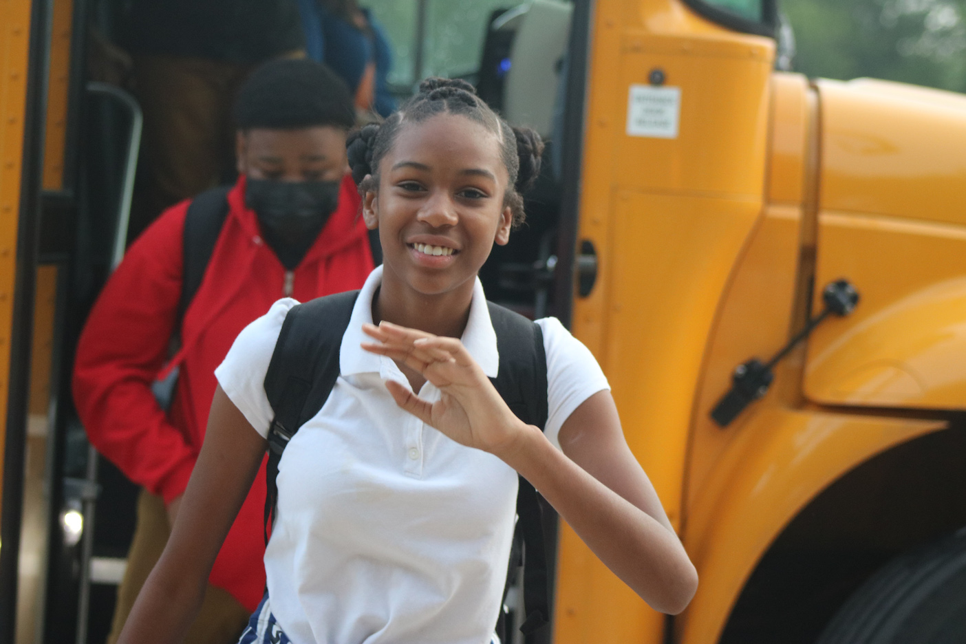 Girl exiting bus