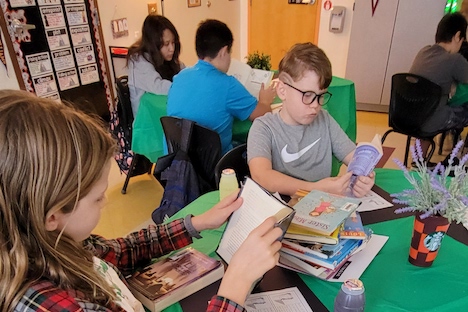 Hawthorne fifth grade students read books