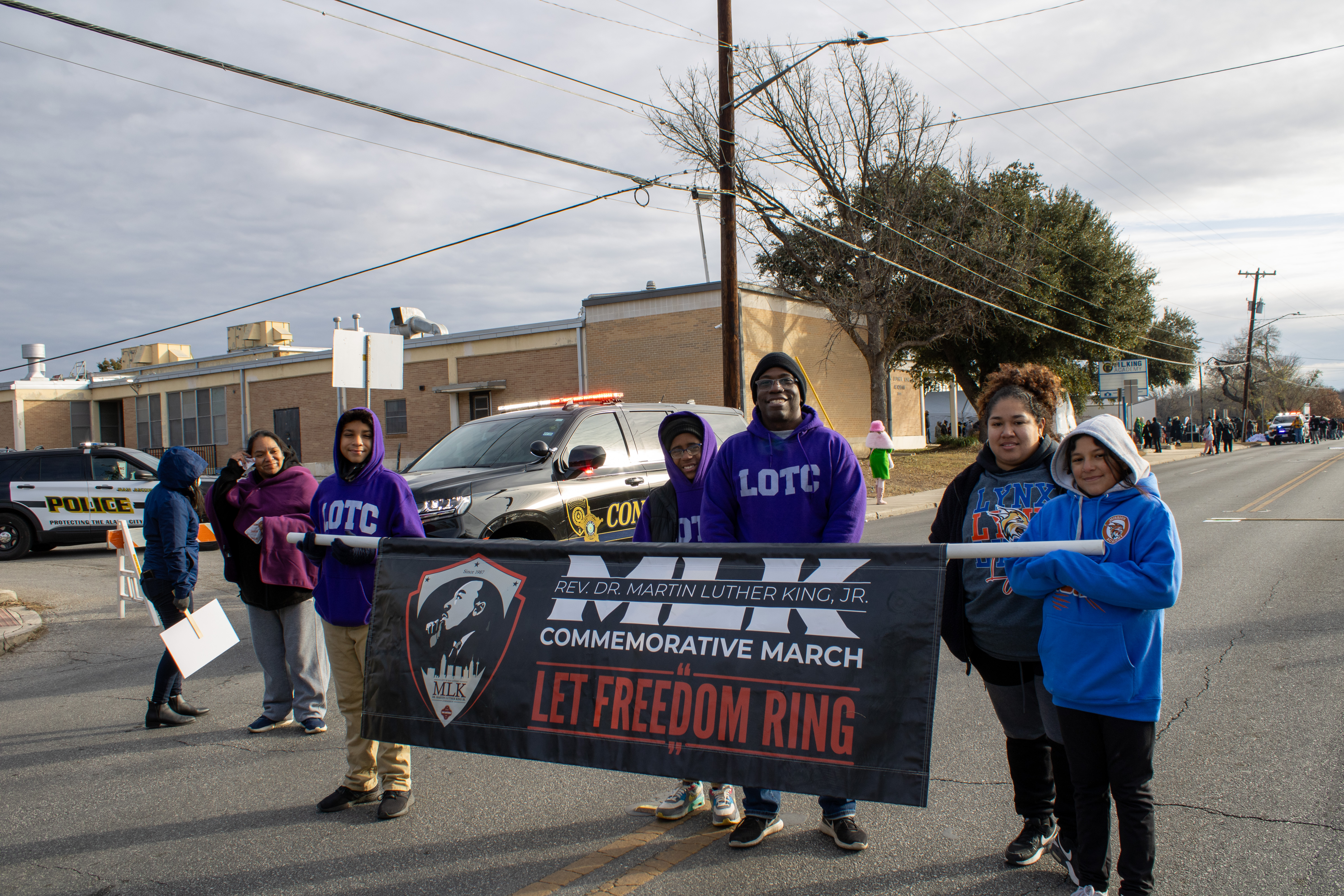 YMLA LOTC students carrying MLK Banner