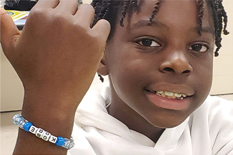 student with bracelet