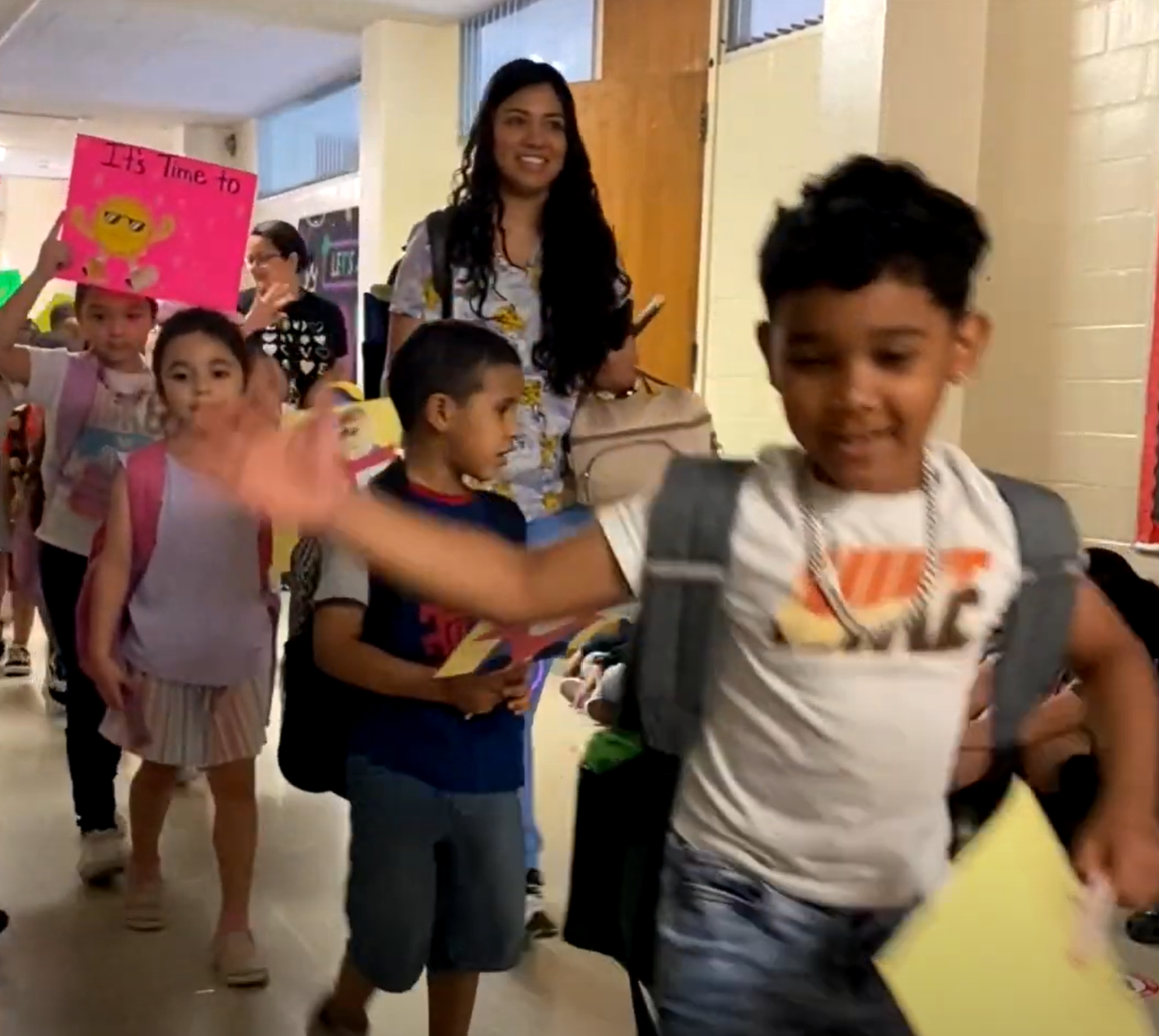 student parade in hallway