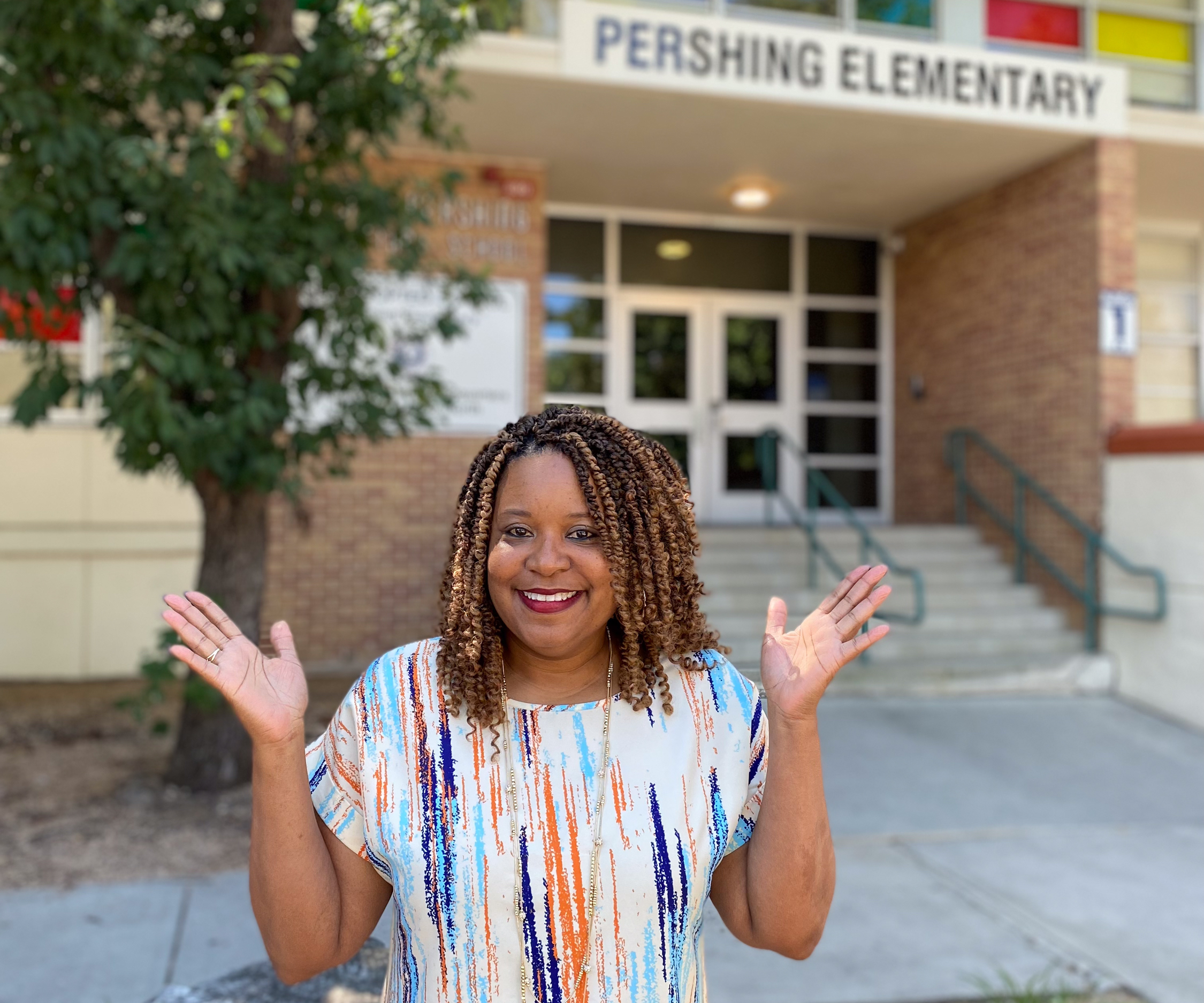 Ms. Livas in front of Pershing
