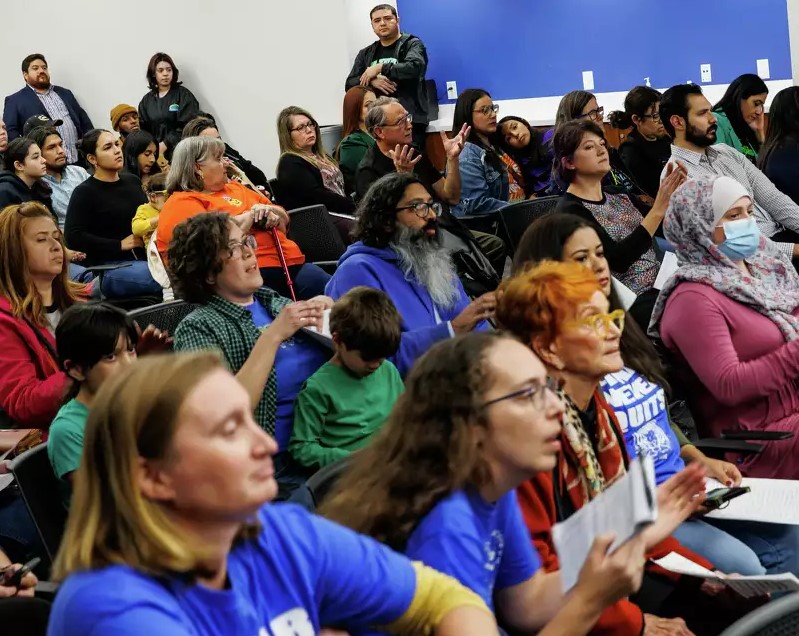 Members of the audience at an SAISD Board meeting