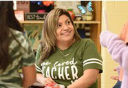 A teacher smiling
