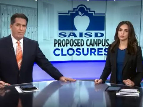 News anchors in front of SAISD logo