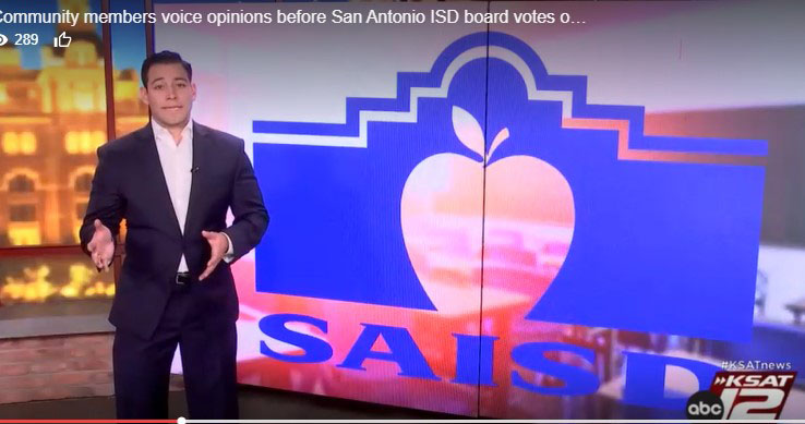Reporter in front of SAISD logo