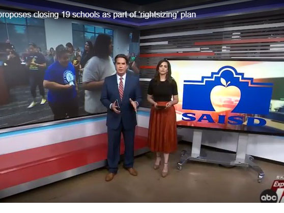 KSAT Anchors in fromt of SAISD logo