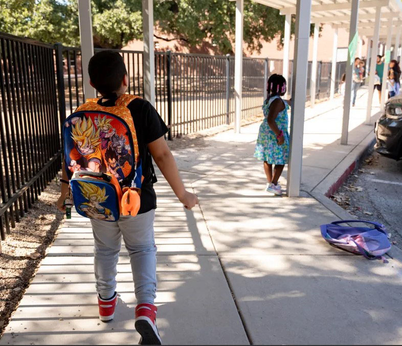 Student s walking into a school