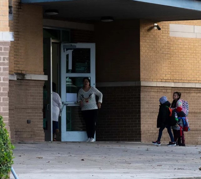 Students walking into a school