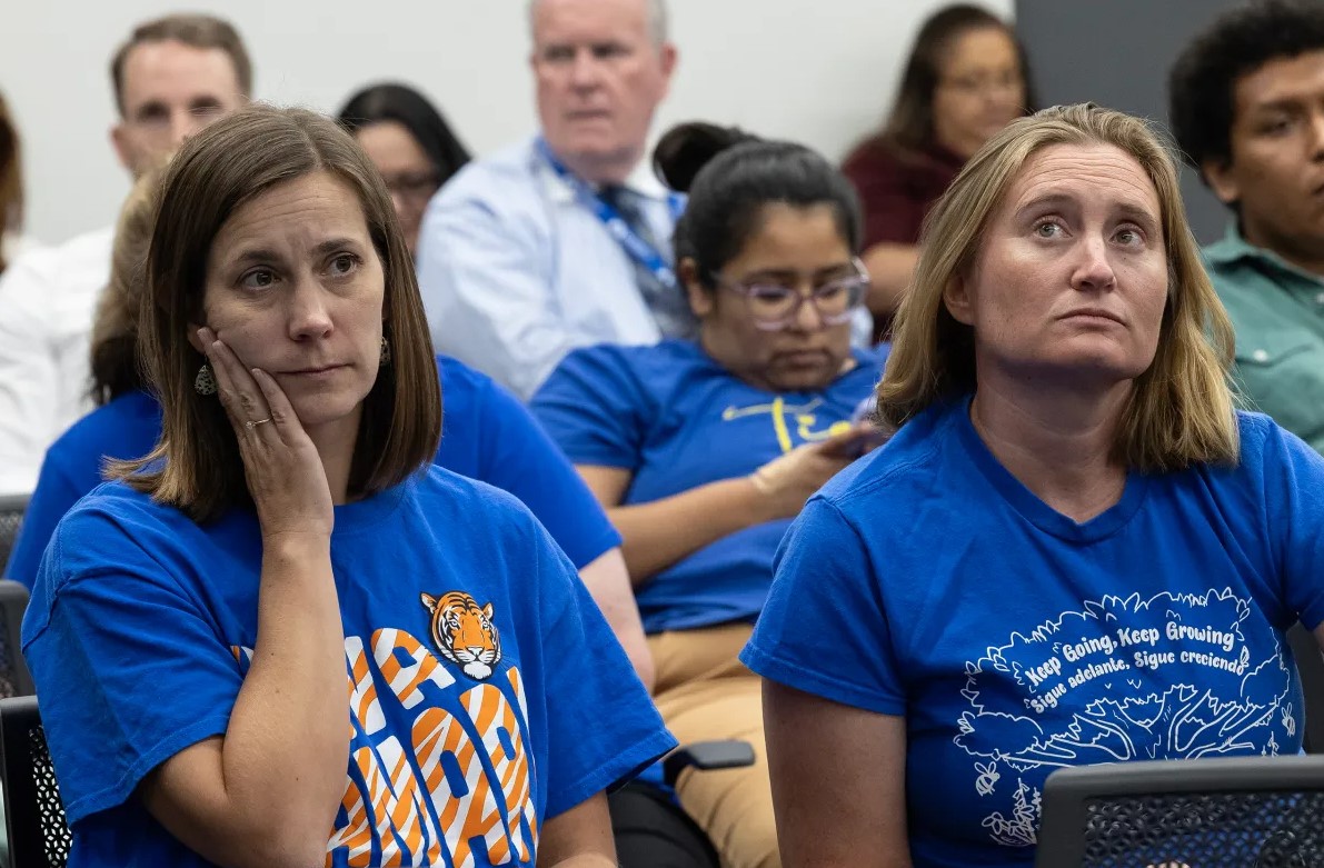 Community member in the audience of an SAISD board meeting