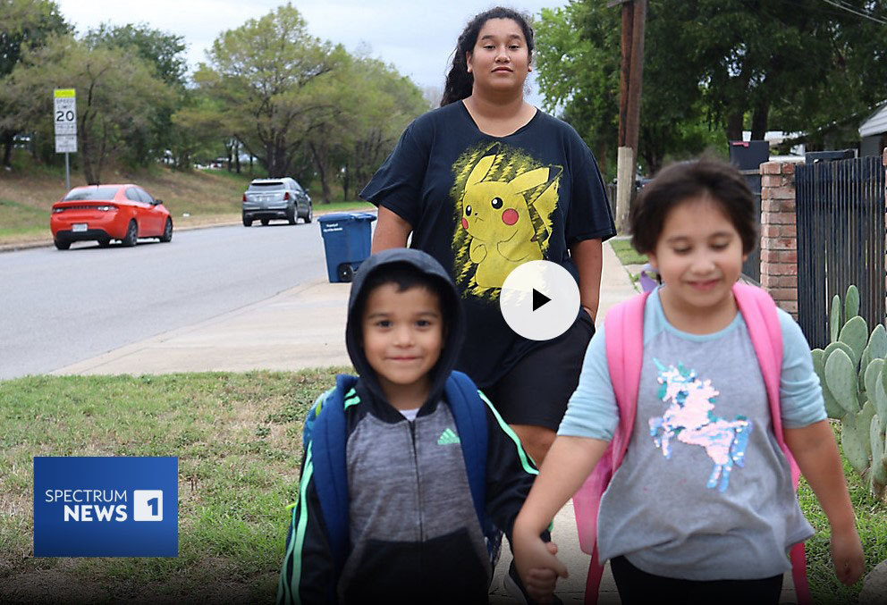 Mother walking children to school