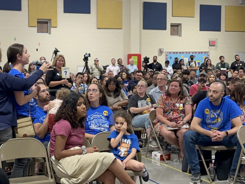 Parents speaking at Neighborhood Meeting