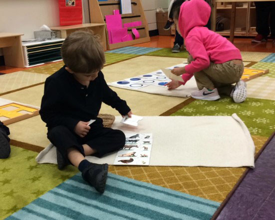 Children playing an educational game in a classroom