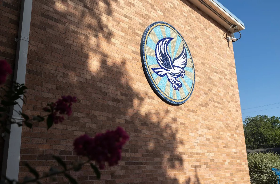 Outside wall of Lowell Middle School, with logo