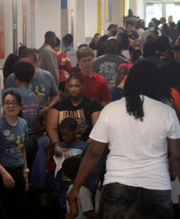 Students walking in a school hallway