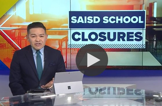 News anchors in front of SAISD logo