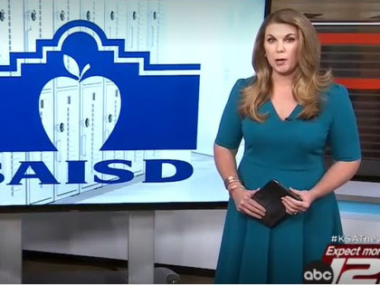 KSAT anchor in front of SAISD logo