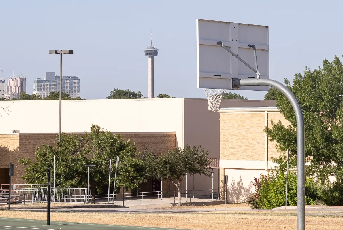 SAISD middle school exterior with Tower of the Americas in the background