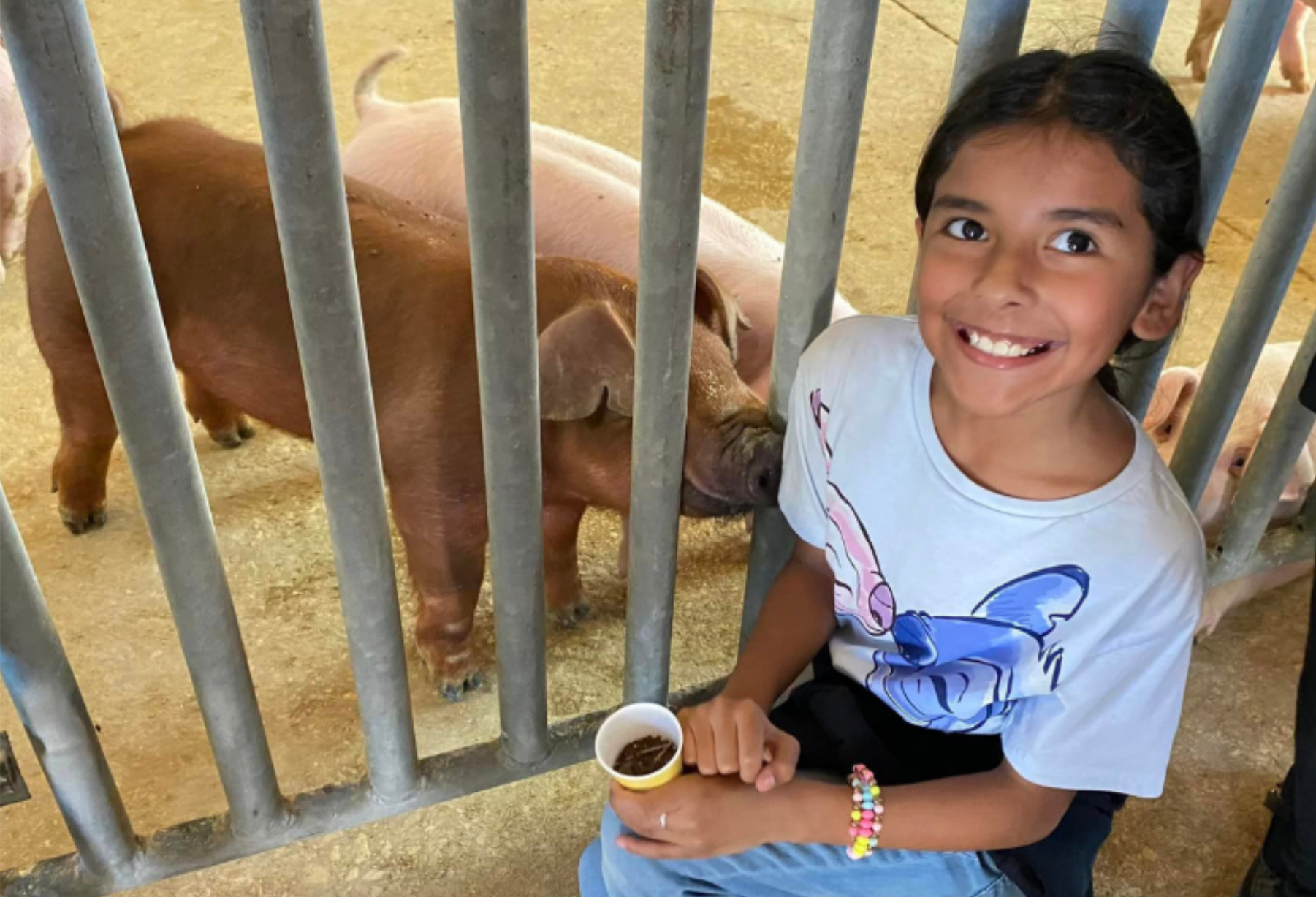 student with piglet